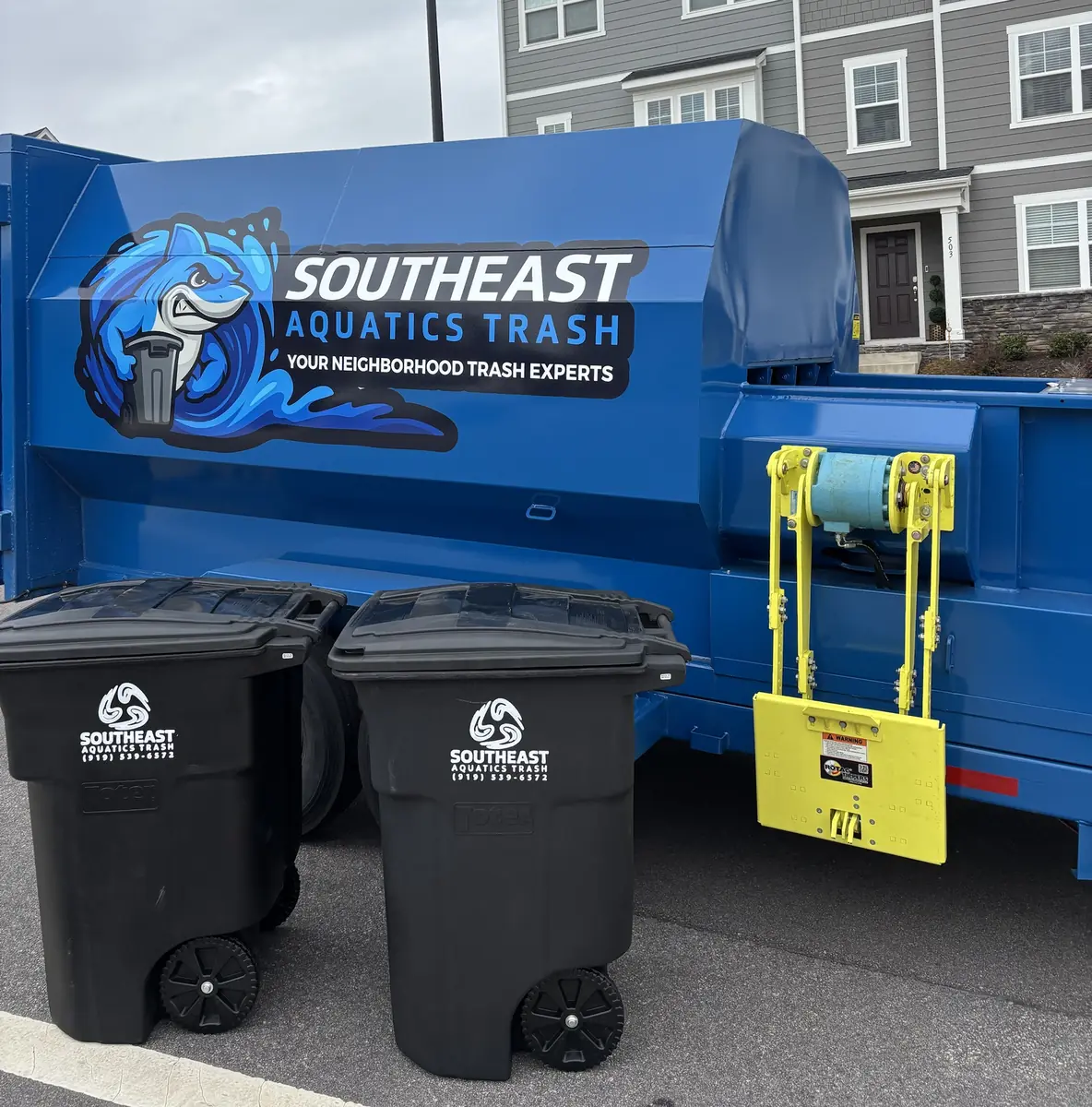 Southeast Aquatics Trash compactor and carts serving a townhome community