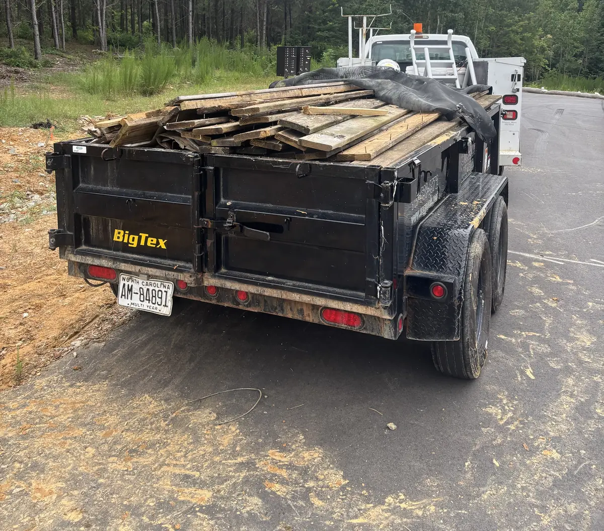 Trailer loaded with scrap lumber from a property cleanout